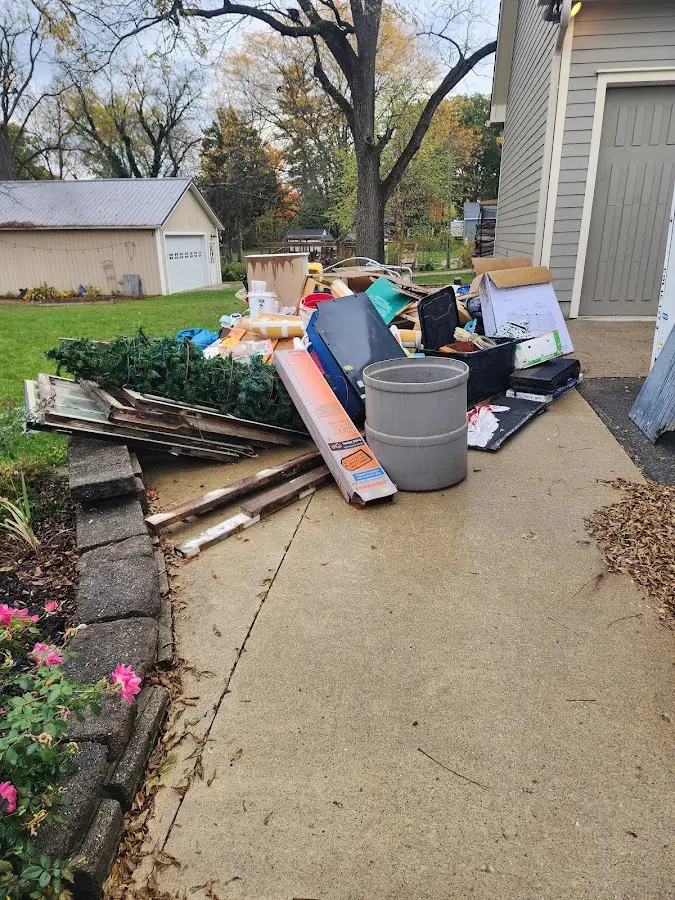 Dumpster being loaded with debris for 3 Yard Dumpster Rental in Burnettown